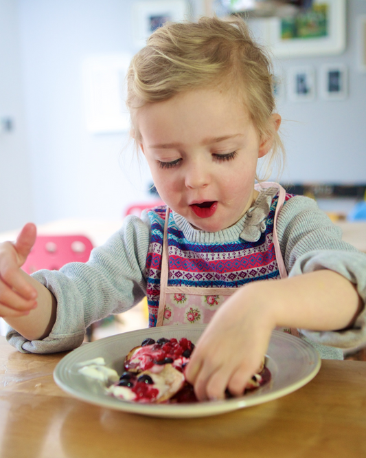 Toddler eating a healthy snack